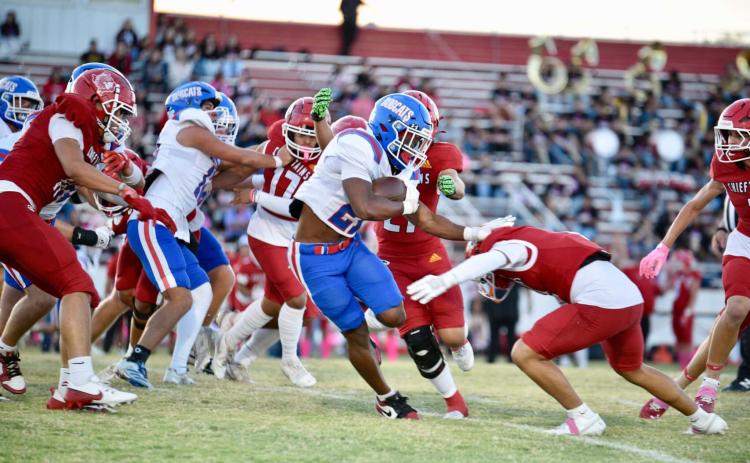 Childress running back Lucian Davis stiff arms a Friona defender during the Bobcats’ 52-0 district opening shutout Friday, Oct. 10 at Chieftain Stadium in Friona. Press Pass Sports/Lori Rabe