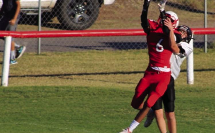 Eighth-grade Firecracker Troy Molina (6) catches the ball close to the endzone before being brought down by a Wheeler Colt. The seventh and eighth grade combined to stop the Colts 60-18 last Thursday, Oct. 20. The Red River Sun/Shauna Salinas