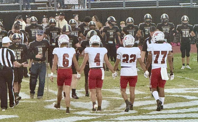 Wellington’s Major Brown (6), Noah Cantu (4), Gustavo Soto (22) and Yobani Moreno (77) prepare to take on the Quanah Indians Friday, Oct. 17 in Quanah, where the Skyrockets took a 50-13 victory to remain undefeated in district play. Courtesy Photo