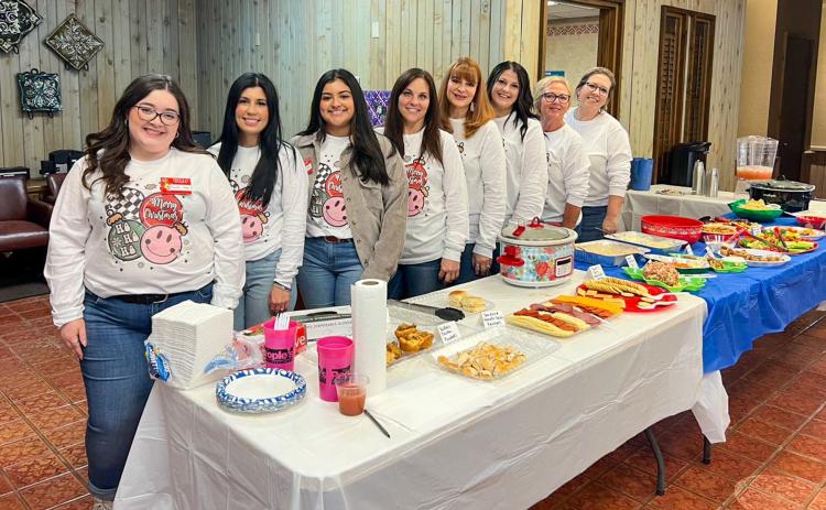 The People’s Federal Credit Union staff greet over 100 guests, many of which were dressed in their holiday best, at the annual Christmas Open House at The People’s Federal Credit Union (FCU) Childress Branch Tuesday, Dec. 12. Photo Courtesy of The People’s Federal Credit Union