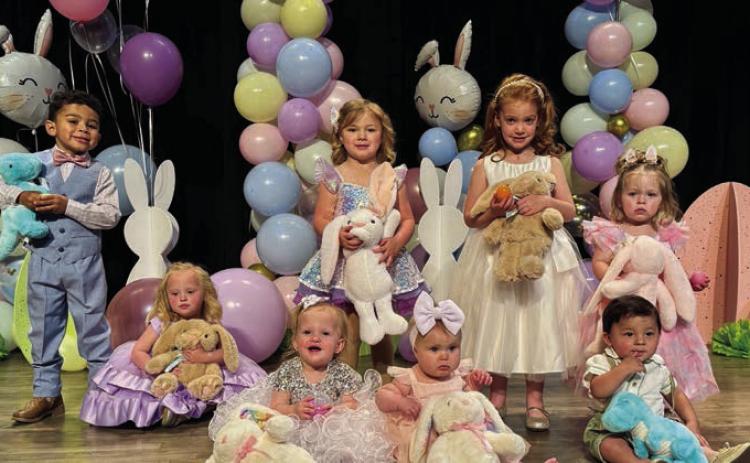 The 2025 Wellington Ritz Theatre crowns two Tiny Tot winners in each of the four age divisions. Front row, from left: Kaydence Mixon, wo-three-year-old; Bristol Brooks and LoRhae Statham, infant-11 months; Lennox Sebastian Kai Cantu, one-year-old. Back row, from left: Augustus Cole Ramirez, four-five-year-old; Kynleigh Dawn Statham, twothree- year-old; Madilyn Gilliam, four-five-year-old; Ava Lyn McCarty, one-year-old. Wellington Ritz Theatre