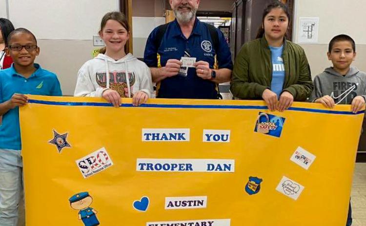 Memphis Independent School District students and staff celebrate National School Resource Officer Day Thursday, Feb. 15, thanking Memphis ISD Security Director Dan Hawthorne. Additionally, Hawthorne visited Austin Elementary School students to discuss the STOPit Anonymous Reporting System, which allows individuals to anonymously report safety, misconduct or compliance concerns to help others or connect with trained crisis counselors from the Crisis Text Line. Photo Courtesy of Memphis ISD