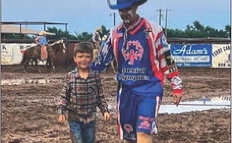 Caleb Peters takes the Saturday night mutton bustin’ championship during the 2022 Wellington Fourth of July Rodeo. Almost an inch of rain delayed the final performance of the rodeo. Goobie the Clown accompanied Caleb back to the gate. Courtesy Photo