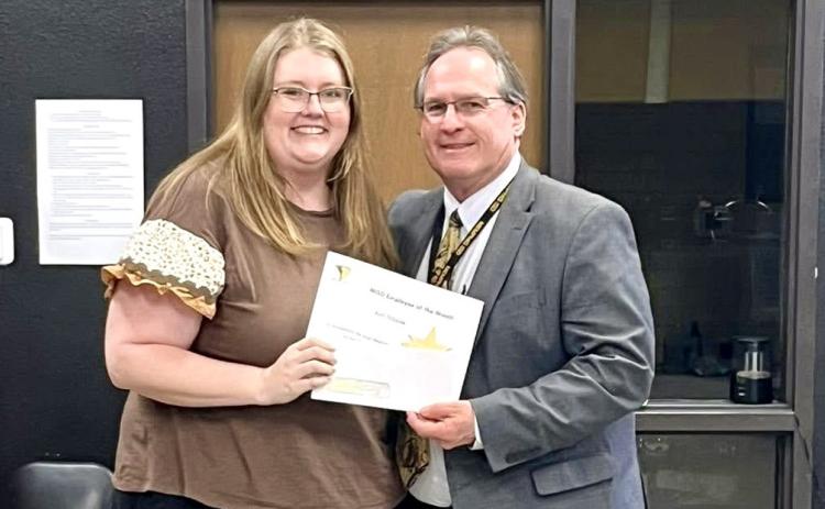 Memphis Independent School District (ISD) Superintendent William Alexander congratulates March Employee of the Month Ami Tribble, who teaches first and second-grade mathematics at Austin Elementary School. Memphis ISD