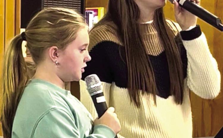 Monson Music Studio students Kinzlee Willis, left, and Saylee Ochoa perform at the Childress Senior Citizens Center luncheon Thursday, Oct. 30, singing five spooky selections just in time for Halloween. Ochoa sang “Spooky, Scary Skeletons,” accompanied by Monson Music Studio owner and instructor Gerald Monson, while Willis sang “The Purple People Eater.” Together, the duo performed “Ghostbusters,” “The Addams Family” and “Witch Doctor.” Courtesy Photo